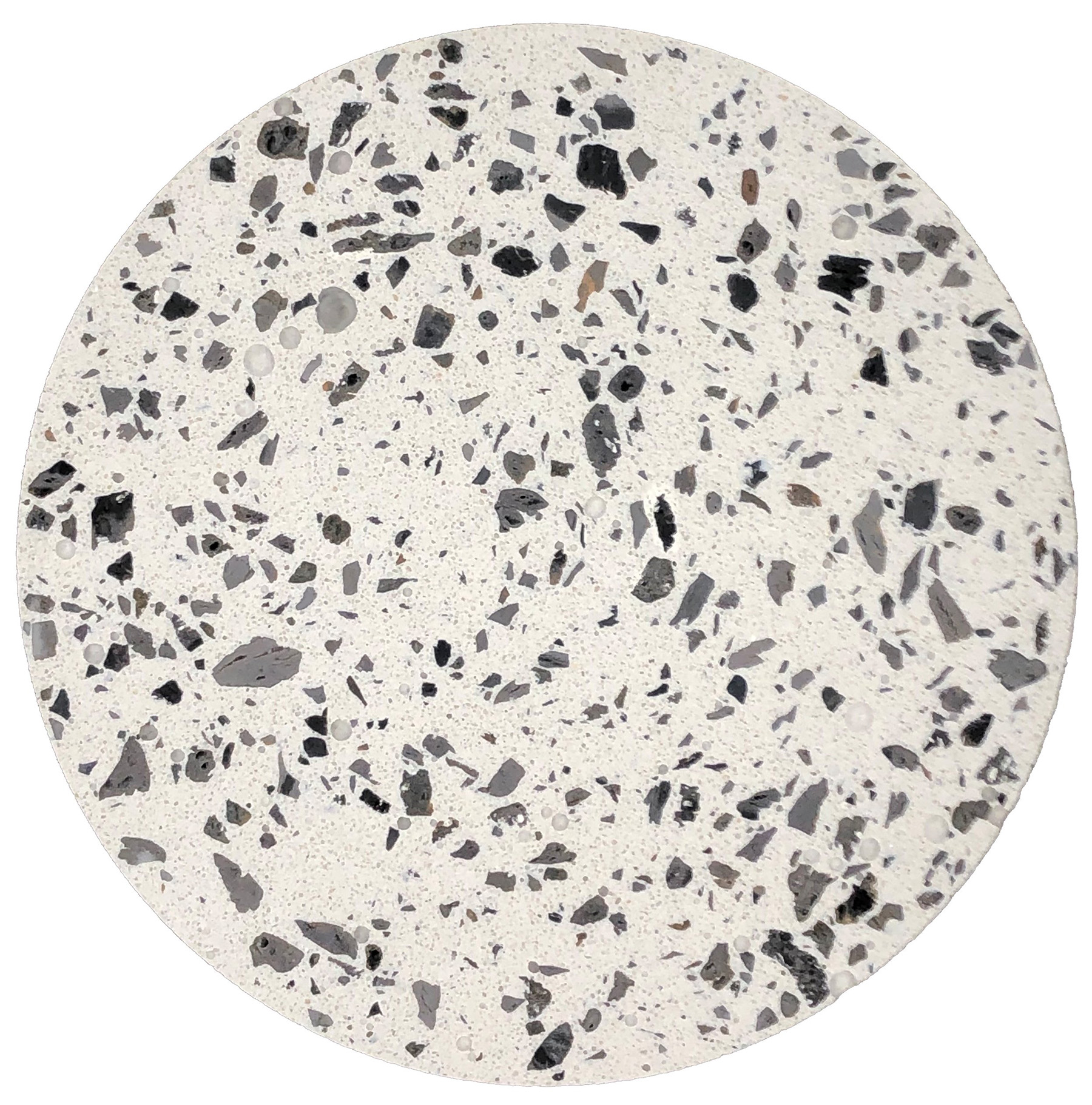 Sample of internally curing concrete. It's a white disc with black spots.
